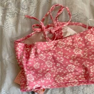 Super cute halter top pink .  It is so cute with the flowers !   Brand new.
